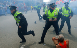 famous image of Police going into action after Boston Marathon bombing