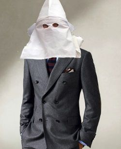 created image of a guy in suit wearing a Klan hood