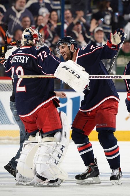 photo of Goalie Sergei Bobrovsky and Winger Nick Foligno doing their usual post game hug after a win
