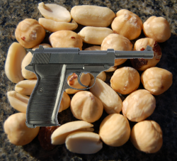 created image of a pistol on top of peanuts