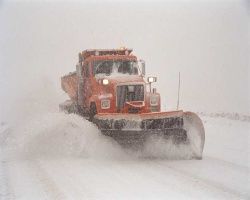 action shot of a snow plow
