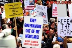 image of protest sign reading Keep your government hands off my Medicare