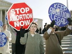 people protesting for and against abortion