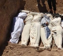 photo showing vicitims of war in Syria in a grave