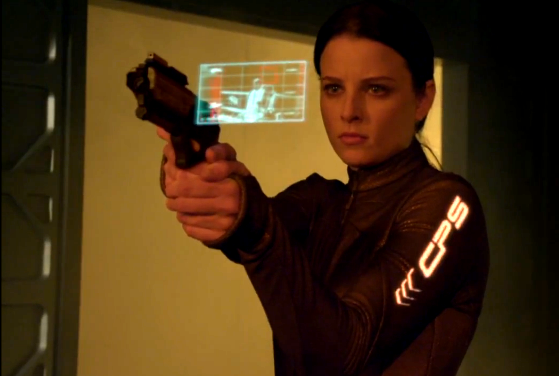 Kiera using her gun with HUD targeting system screencap of Kiera using her gun with HUD targeting system