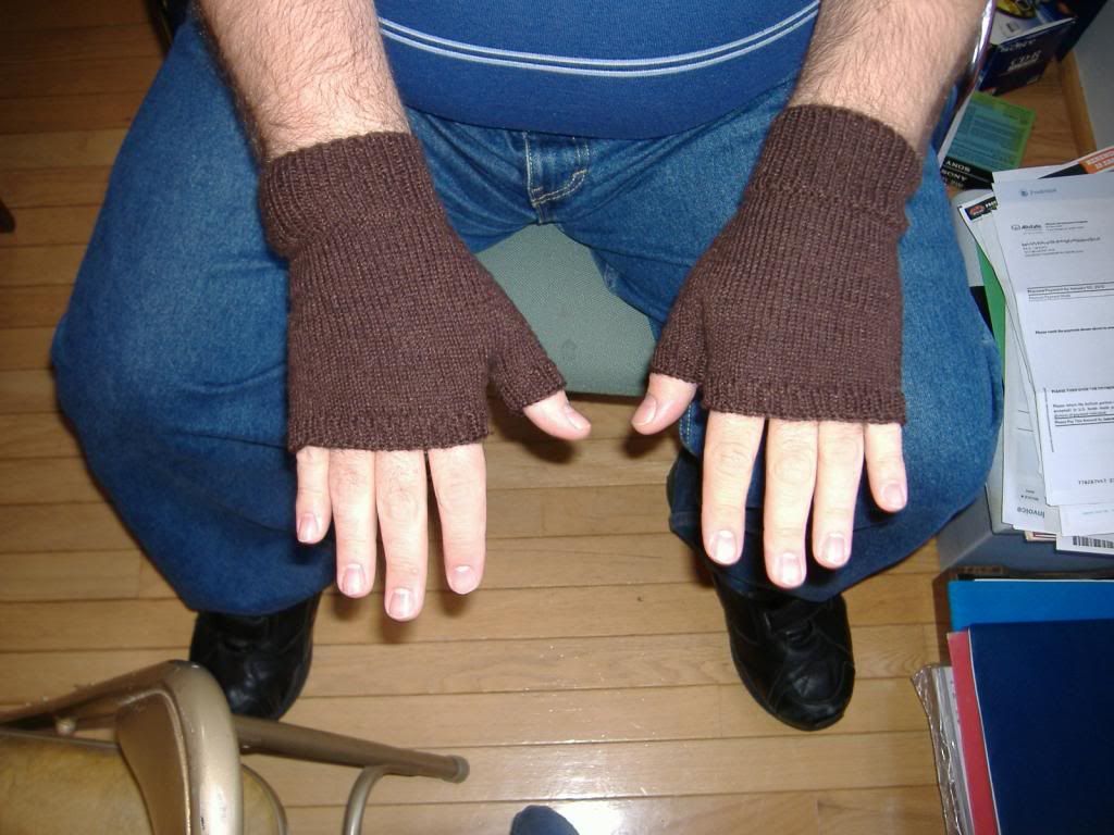 mitts being worn, palm down