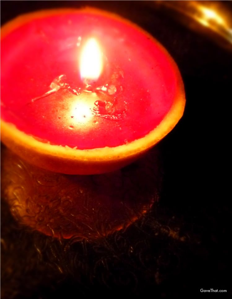 Candle created out of an orange peel and gel wax an exotic Blood Orange Candle