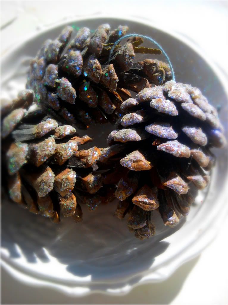 Glittery dusted handmade pine cone ornaments for Christmas decorating