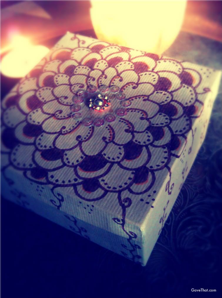 Brown inked on Mehndi designs on a natural recycled paper gift box