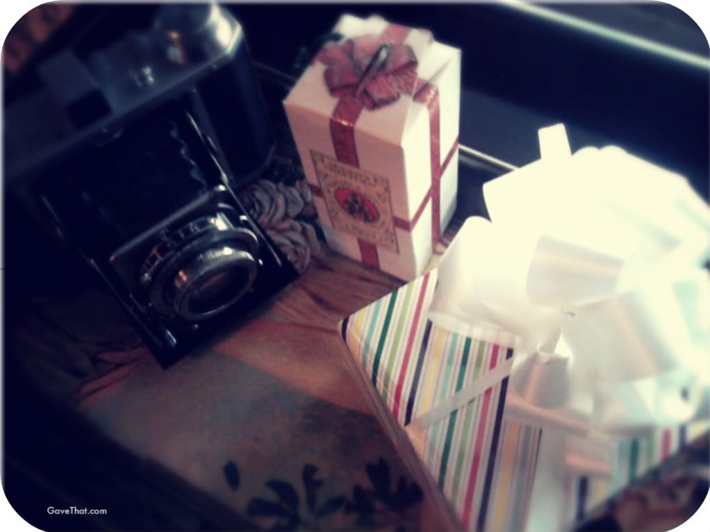 Fifties inspired gift wrap with vintage Frank camera and spirits gift boxed for hanging on a Christmas tree