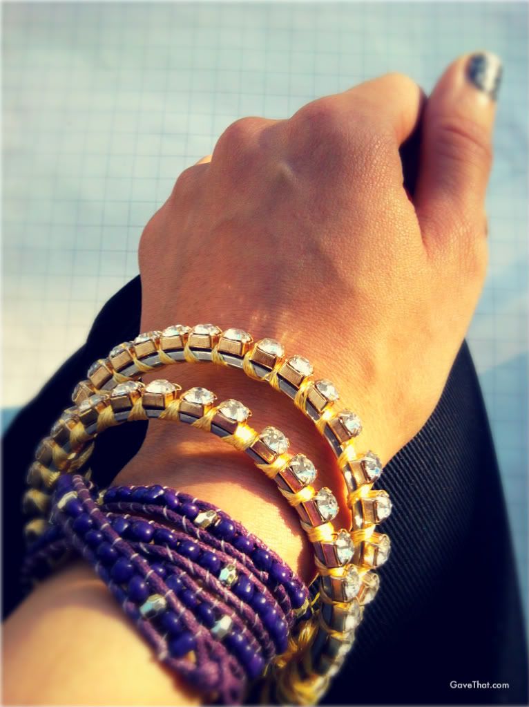 The finished DIY yellow silk wrapped crystal bangles with a purple beaded wrap bracelet