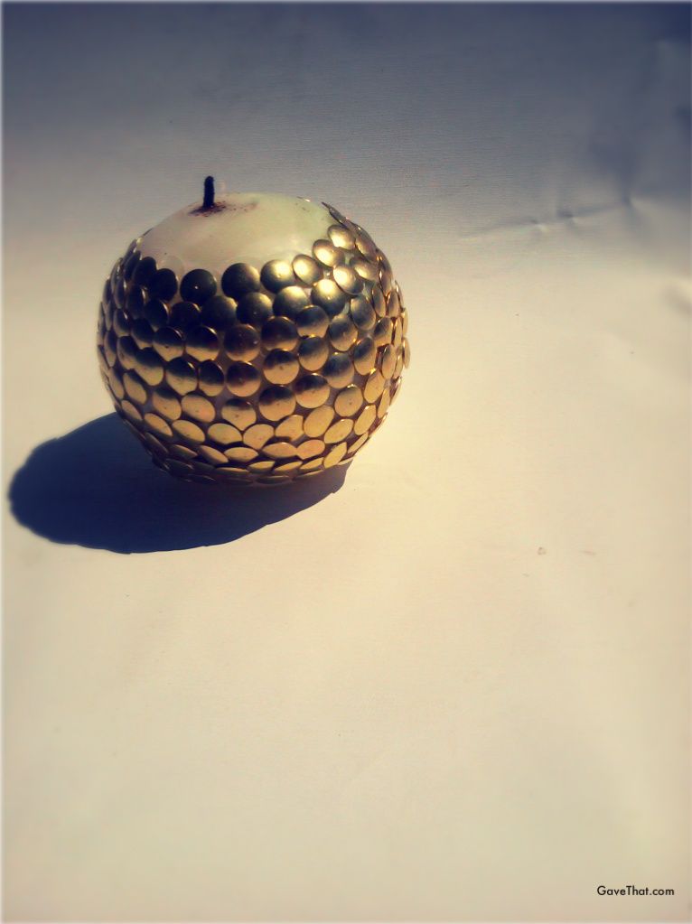 Finished DIY thumb tack covered scaly candle