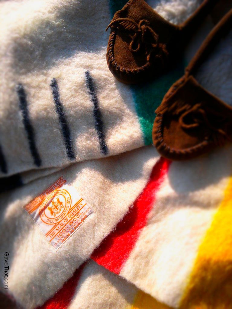 Hudson Bay three and one half point blanket and Minnetonka moccasins