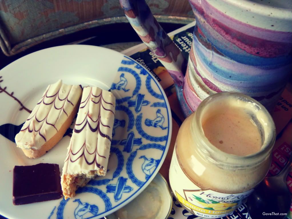 Leo Chocolate Be Bop Biscotti Honey Ridge Farm Lemon Honey Cream and handmade Ed and Diane Swick Klickitat pottery cup from the Withered Herb gift basket this afternoon
