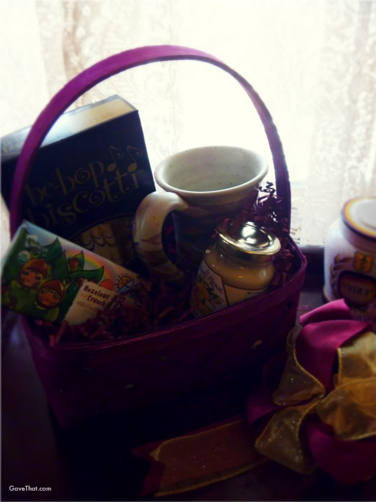 Opening up the Muddy Waters Herbal Tea gift basket by The Withered Herb with Klickitat handmade pottery mug Organic Muddy Waters tea Be Bop Biscotti Leo Chocolate and Lemon Honey Cream by Honey Ridge Farms from The Withered Herb