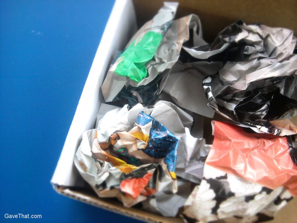 A box filled with crumpled recycled magazine pages