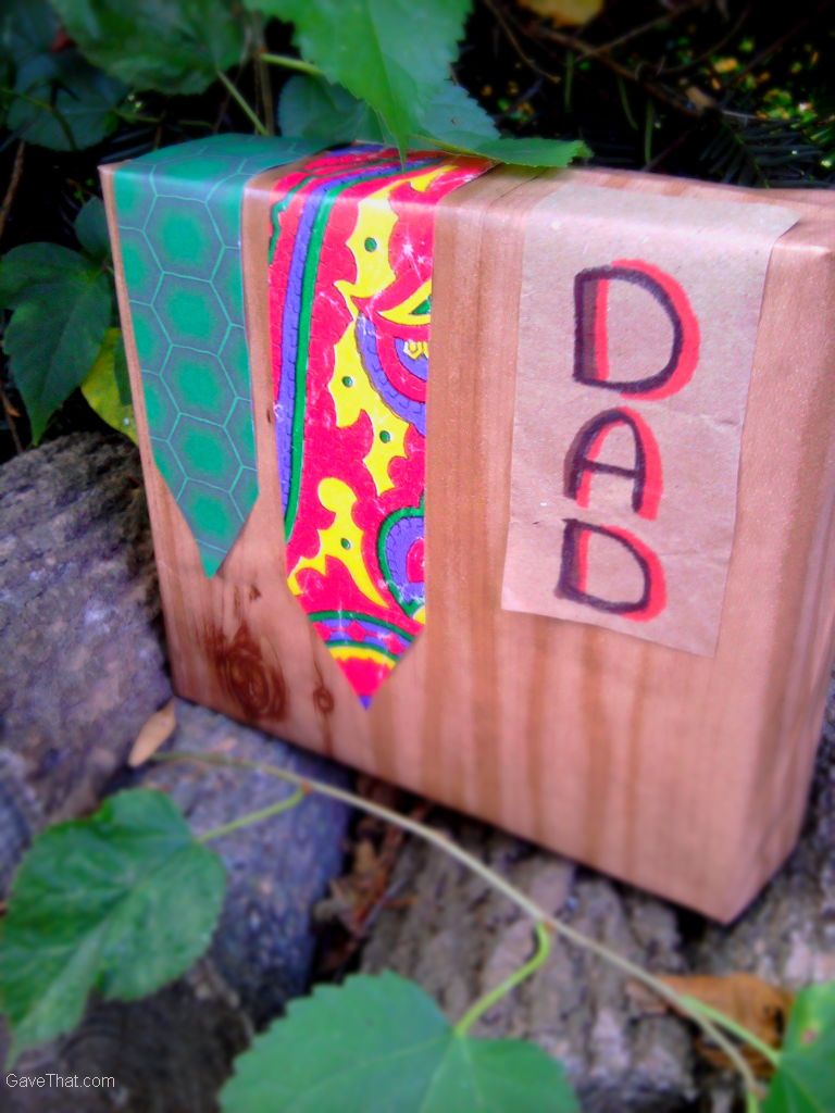 Fathers Day inspired gift wrap using wood grain wrapping paper cut out neckties and brown paper sign for DAD