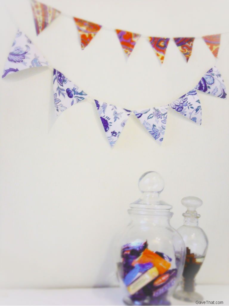 Simple wrapping paper flag garlands using recycled vintage patterned gift wrap