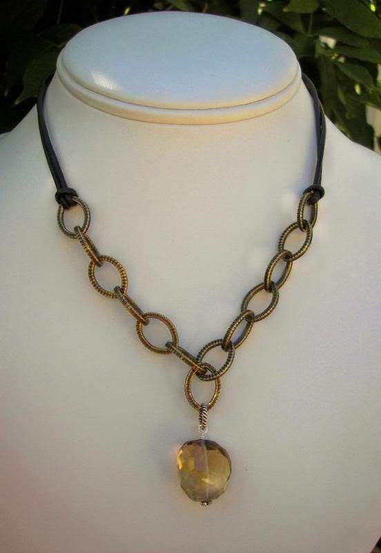 Chain link and leather pendant with topaz