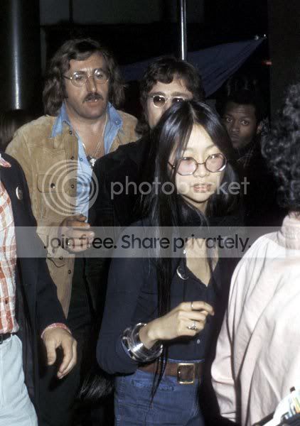 Mal Evans accompanies John Lennon and May Pang