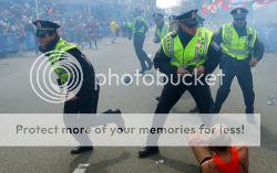 famous image of Police going into action after Boston Marathon bombing