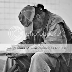 homeless man praying