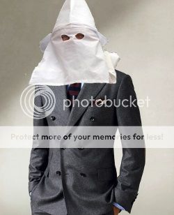 created image of a guy in suit wearing a Klan hood