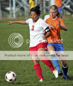 image of Teen girls playing soccer