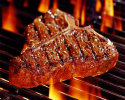 photo of a steak on a grill