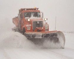 image of a snow plow moving snow