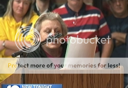 screencap of woman who was booed at school board meeting